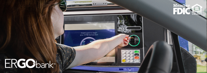 Woman inserting her card at an Ergo Bank ITM machine.