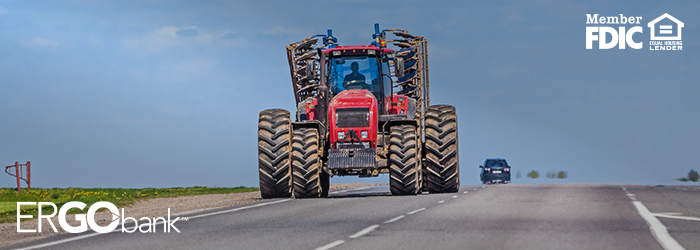 Tractor driving on the main road